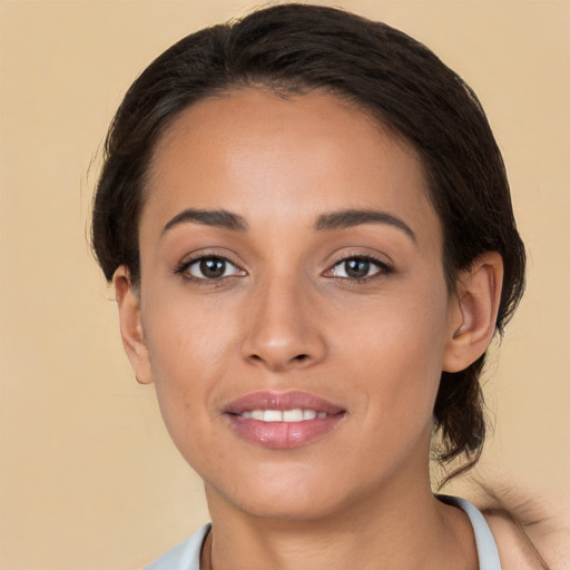 Joyful white young-adult female with medium  brown hair and brown eyes