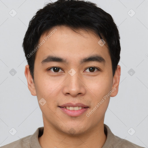 Joyful asian young-adult male with short  brown hair and brown eyes