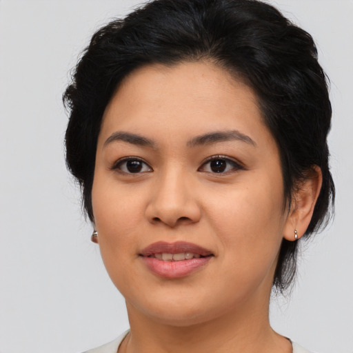 Joyful asian young-adult female with medium  black hair and brown eyes