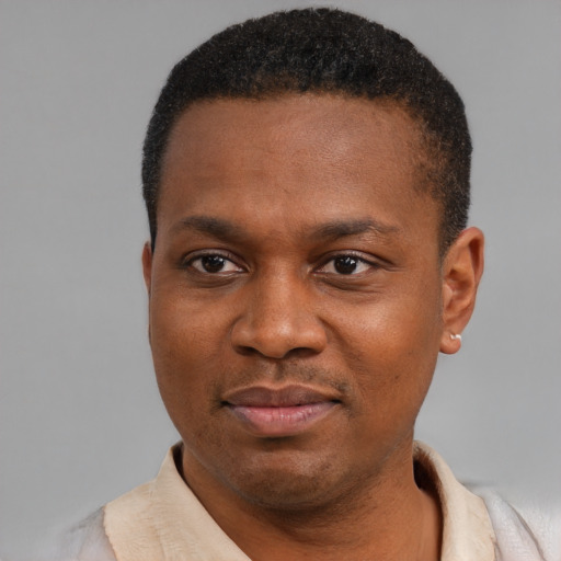 Neutral latino young-adult male with short  brown hair and brown eyes