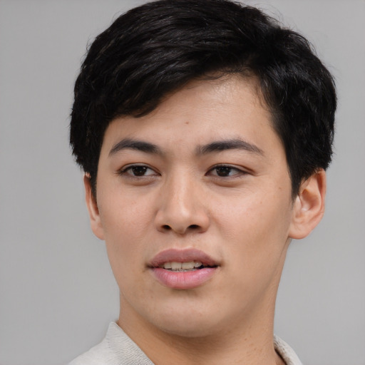 Joyful white young-adult male with short  black hair and brown eyes