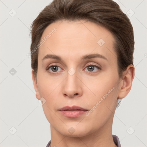 Neutral white young-adult female with short  brown hair and brown eyes