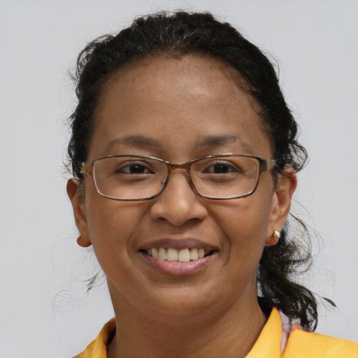 Joyful latino adult female with short  brown hair and brown eyes