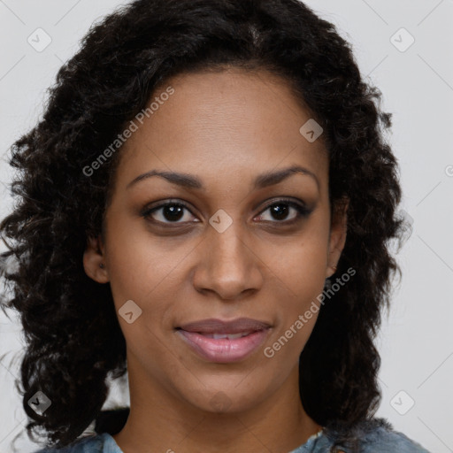 Joyful black young-adult female with long  brown hair and brown eyes