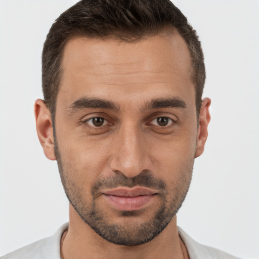 Joyful white young-adult male with short  brown hair and brown eyes