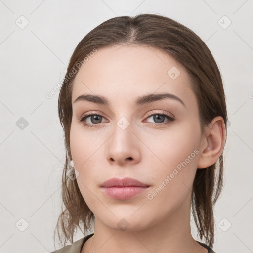 Neutral white young-adult female with medium  brown hair and grey eyes