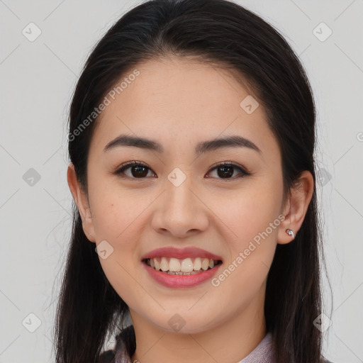 Joyful white young-adult female with long  brown hair and brown eyes