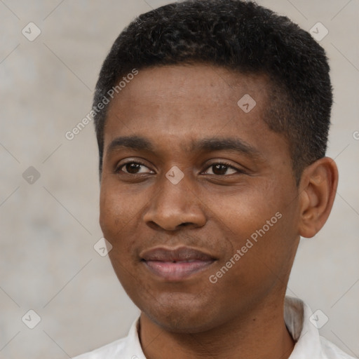 Joyful black young-adult male with short  black hair and brown eyes