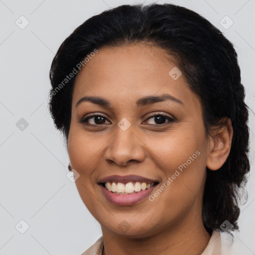 Joyful latino young-adult female with medium  black hair and brown eyes