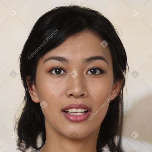 Joyful asian young-adult female with medium  black hair and brown eyes