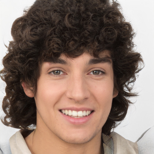 Joyful white young-adult male with medium  brown hair and brown eyes