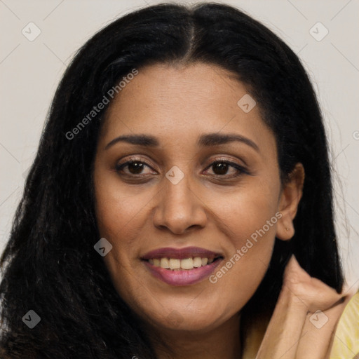 Joyful latino young-adult female with long  black hair and brown eyes