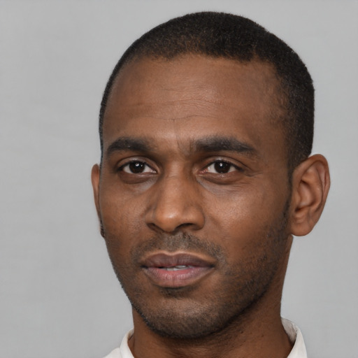 Neutral latino adult male with short  black hair and brown eyes