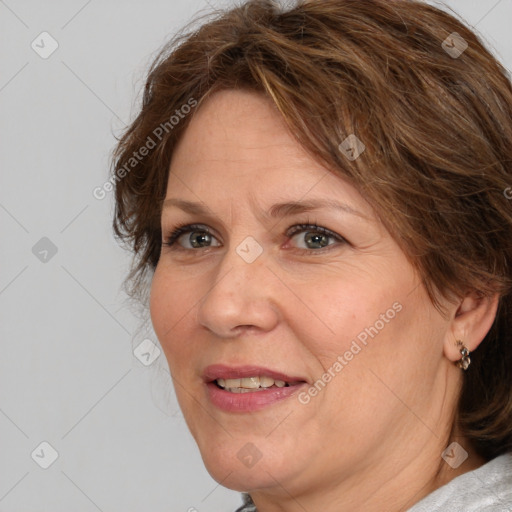 Joyful white adult female with medium  brown hair and brown eyes