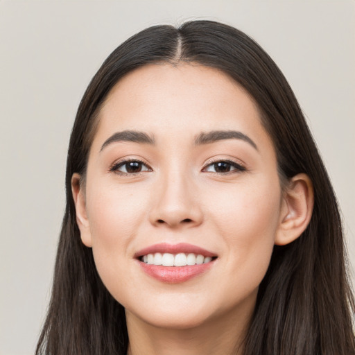 Joyful white young-adult female with long  black hair and brown eyes