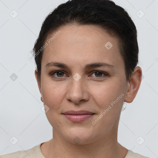 Joyful white young-adult female with short  brown hair and grey eyes