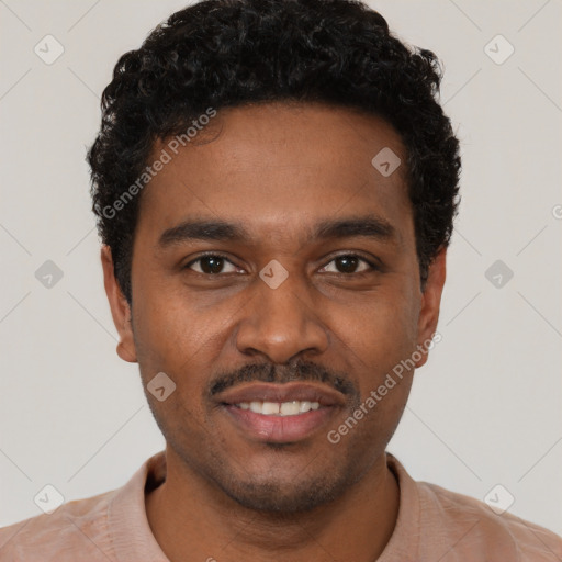 Joyful black young-adult male with short  brown hair and brown eyes