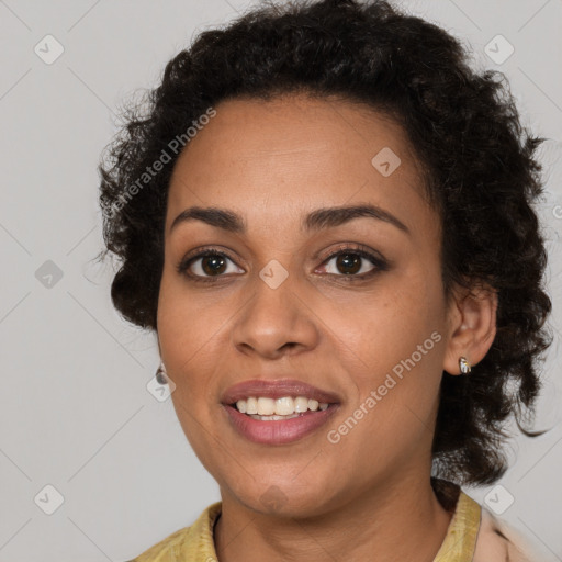 Joyful black young-adult female with short  brown hair and brown eyes