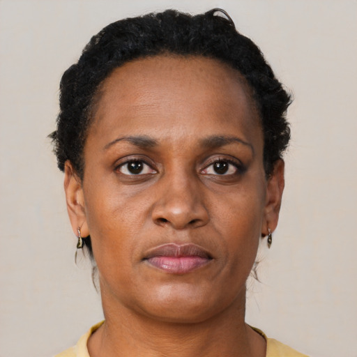 Neutral black adult female with short  brown hair and brown eyes