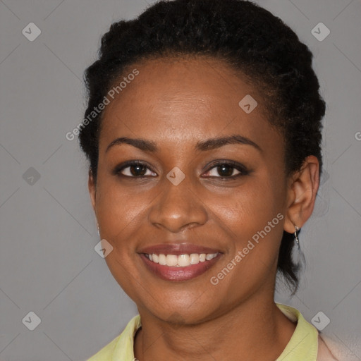 Joyful black young-adult female with short  brown hair and brown eyes