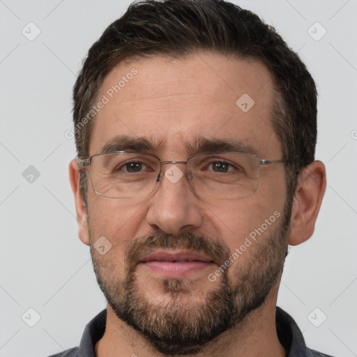 Joyful white adult male with short  brown hair and brown eyes