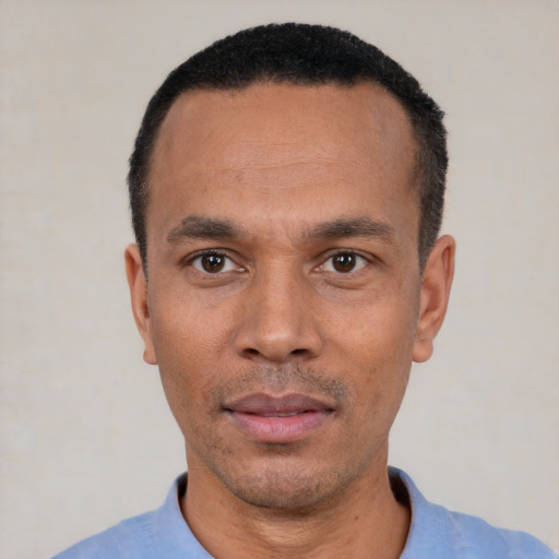 Neutral latino adult male with short  black hair and brown eyes