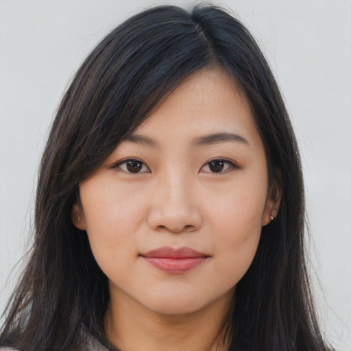 Joyful asian young-adult female with long  brown hair and brown eyes
