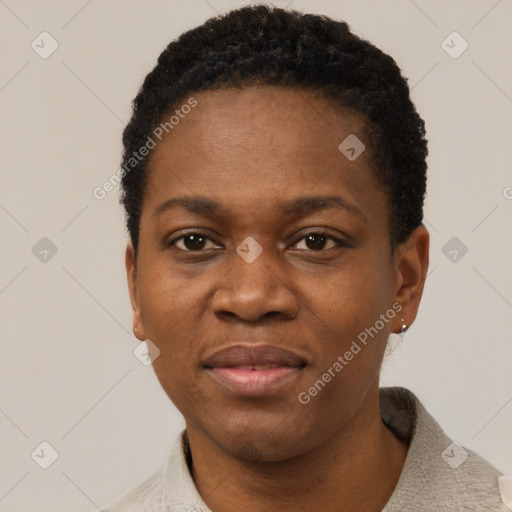 Joyful black young-adult female with short  black hair and brown eyes