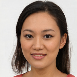 Joyful asian young-adult female with medium  brown hair and brown eyes