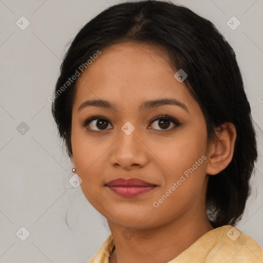 Joyful latino young-adult female with medium  brown hair and brown eyes