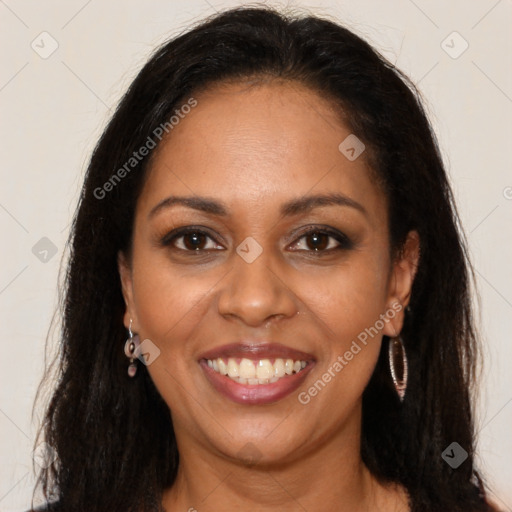 Joyful black young-adult female with long  brown hair and brown eyes