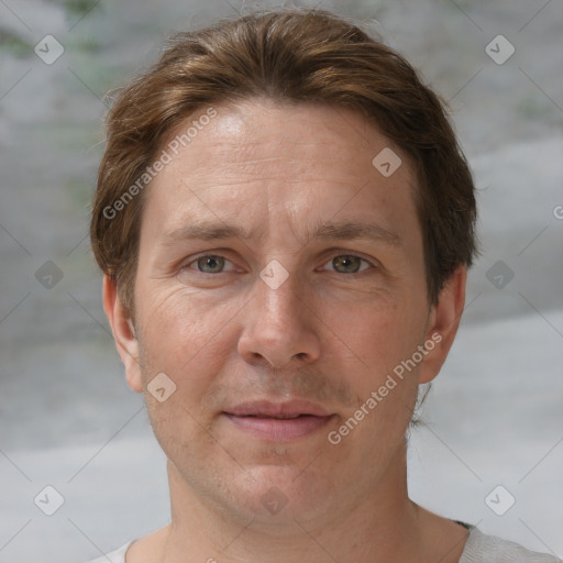 Joyful white adult male with short  brown hair and grey eyes