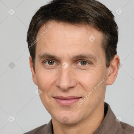 Joyful white adult male with short  brown hair and brown eyes