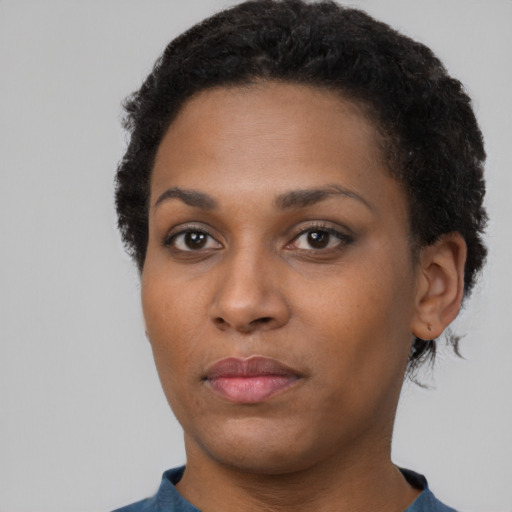 Neutral black young-adult female with short  black hair and brown eyes