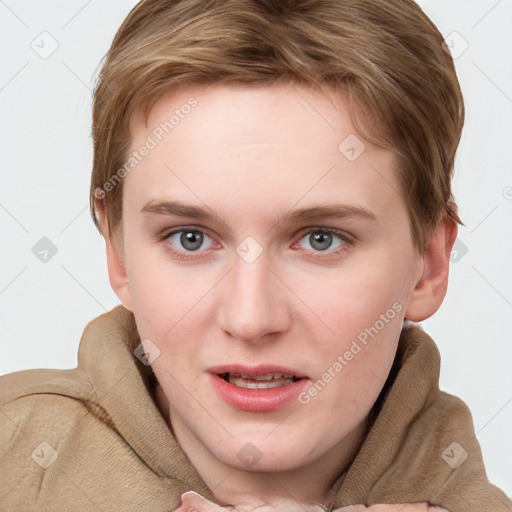 Joyful white young-adult female with short  brown hair and blue eyes