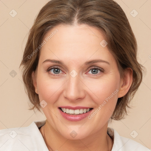 Joyful white adult female with medium  brown hair and grey eyes