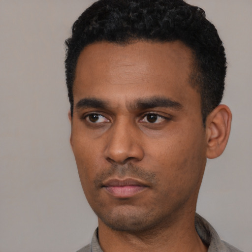 Neutral black young-adult male with short  black hair and brown eyes
