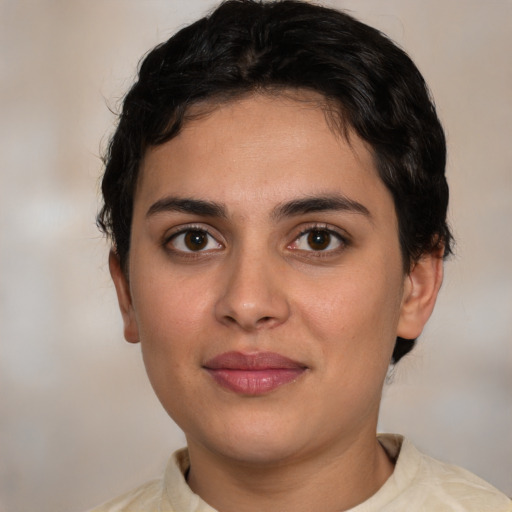 Joyful white young-adult female with short  brown hair and brown eyes