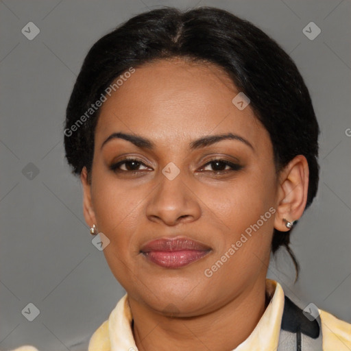 Joyful latino adult female with medium  brown hair and brown eyes