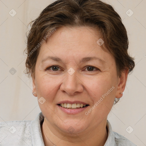 Joyful white adult female with short  brown hair and brown eyes