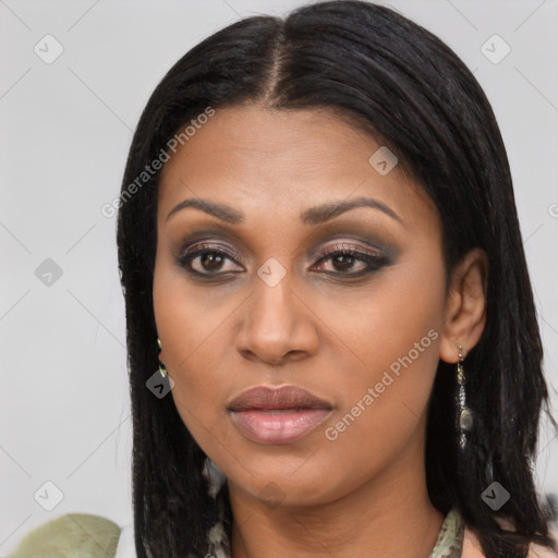 Joyful black young-adult female with long  brown hair and brown eyes