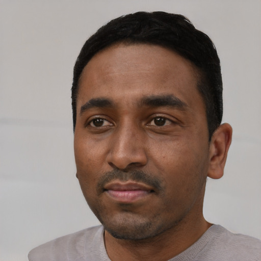Neutral black young-adult male with short  black hair and brown eyes