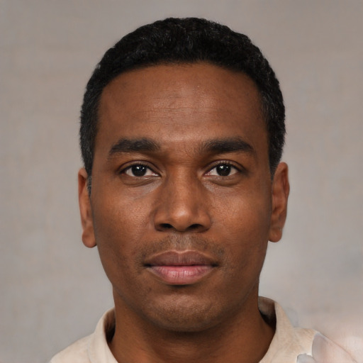 Neutral black young-adult male with short  black hair and brown eyes