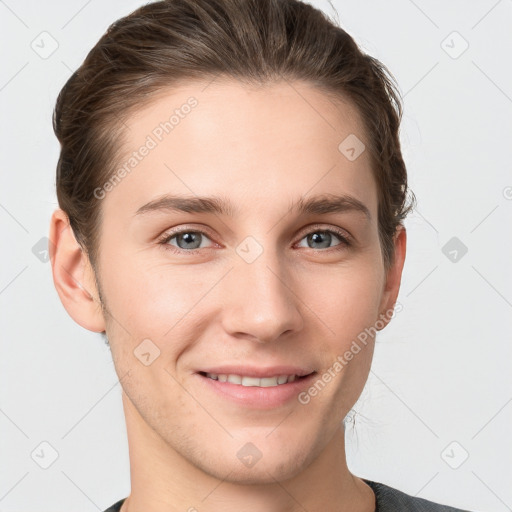 Joyful white young-adult female with short  brown hair and grey eyes