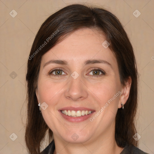 Joyful white adult female with medium  brown hair and green eyes