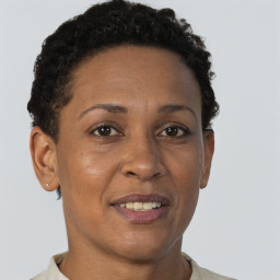 Joyful black adult female with short  brown hair and brown eyes