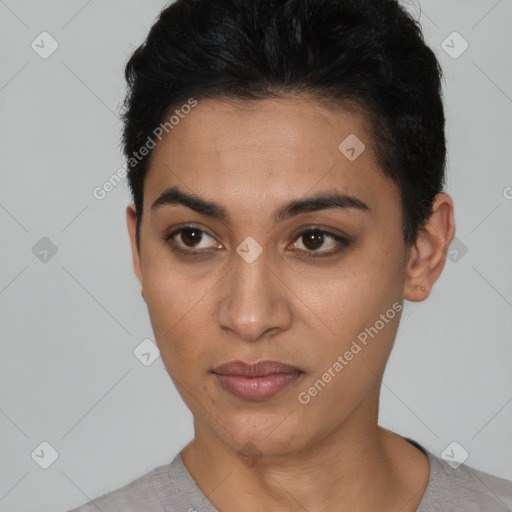 Joyful latino young-adult female with short  black hair and brown eyes