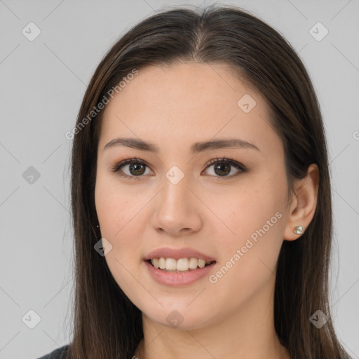 Joyful white young-adult female with long  brown hair and brown eyes