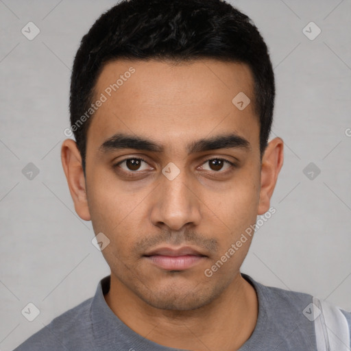 Neutral latino young-adult male with short  black hair and brown eyes