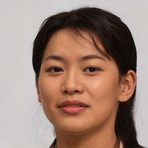 Joyful asian young-adult female with medium  brown hair and brown eyes